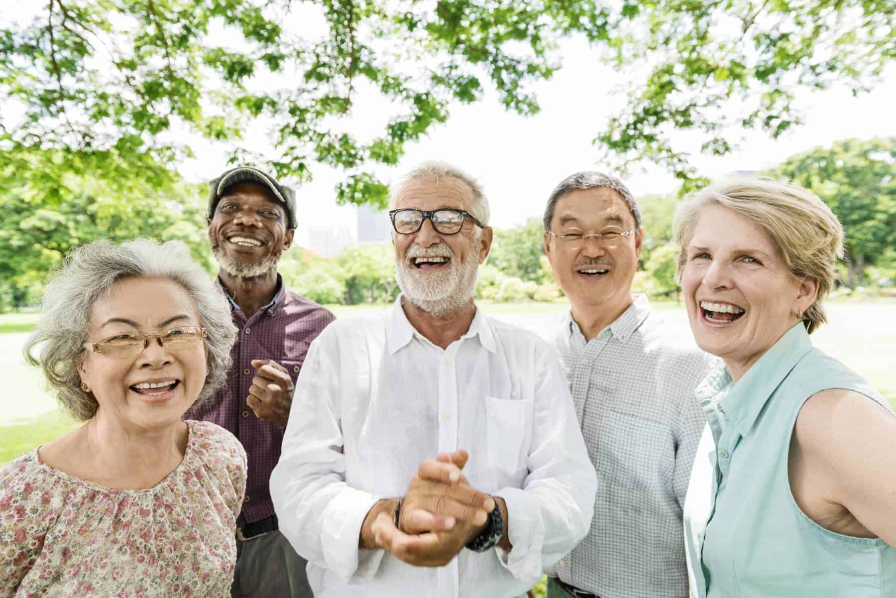 happy seniors spending time together outside