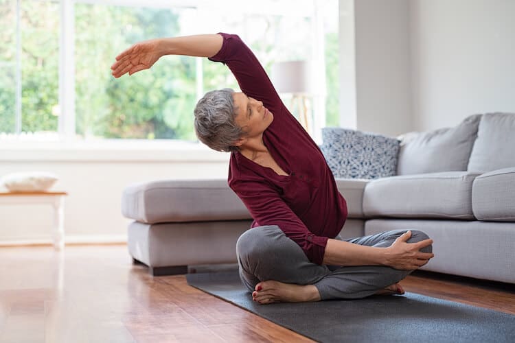 A senior woman practicing yoga