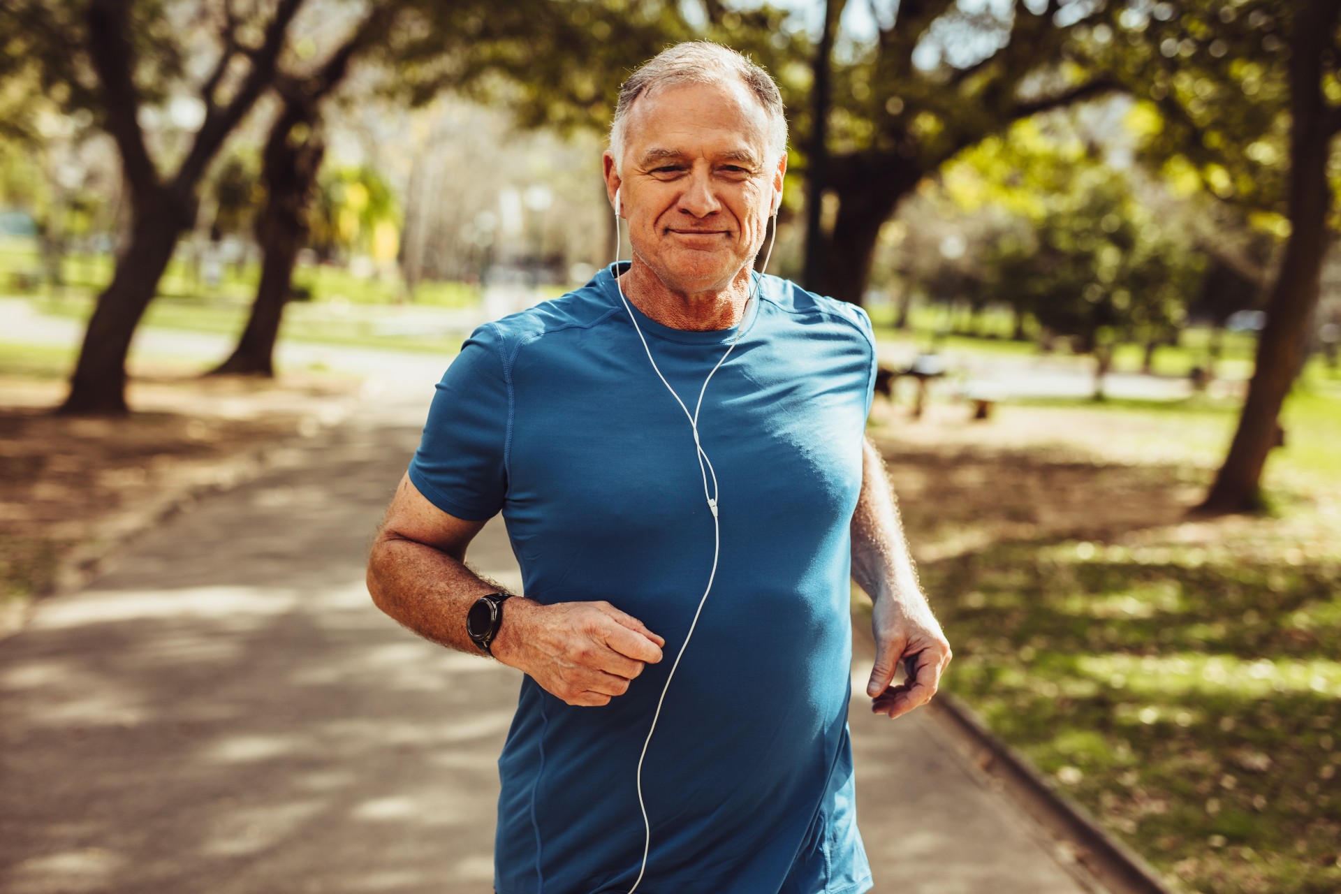 Happy senior man on a run